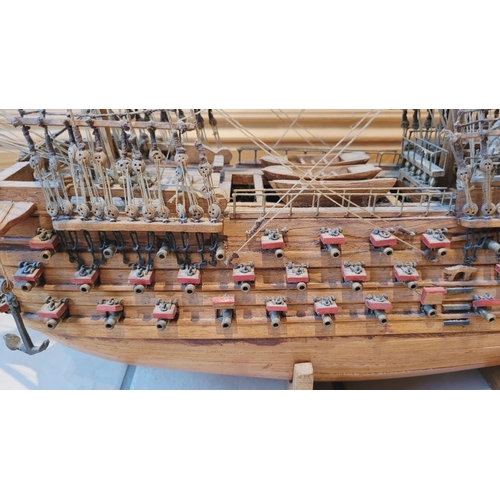 176 - A LARGE HANDMADE MODEL OF THE HMS VICTORY, made by a firm of model makers in Mauritius, Dimensions: ... 