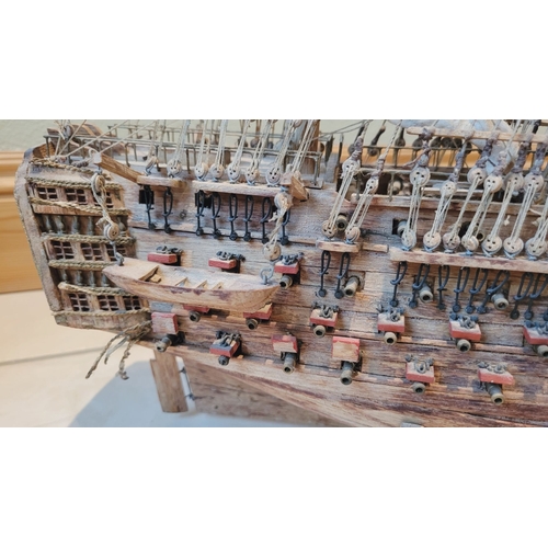 176 - A LARGE HANDMADE MODEL OF THE HMS VICTORY, made by a firm of model makers in Mauritius, Dimensions: ... 