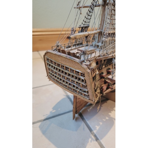 176 - A LARGE HANDMADE MODEL OF THE HMS VICTORY, made by a firm of model makers in Mauritius, Dimensions: ... 