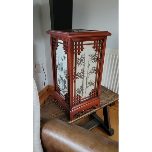 179 - A JAPANESE CARVED WOODEN & GLAZED TABLE LAMP, each of the glazed sides decorated with bamboo designs... 