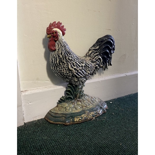 192 - A VINTAGE PAINTED CAST DOOR STOPPER, in the form of rooster, dimensions: 30.5cm high approx.