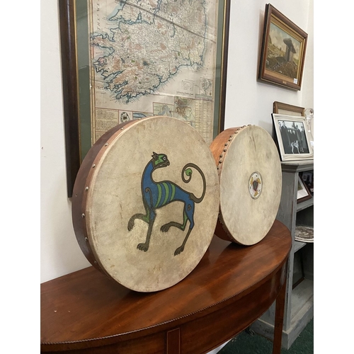 193 - TWO IRISH BODHRAN DRUMS, both with nice Celtic designs, dimensions: 45.5cm & 46.5cm diameter approx.