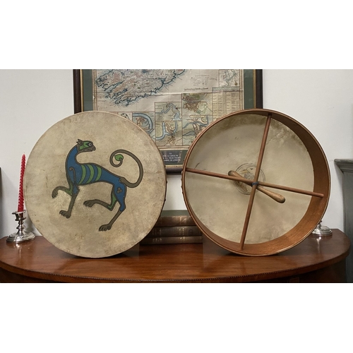 193 - TWO IRISH BODHRAN DRUMS, both with nice Celtic designs, dimensions: 45.5cm & 46.5cm diameter approx.