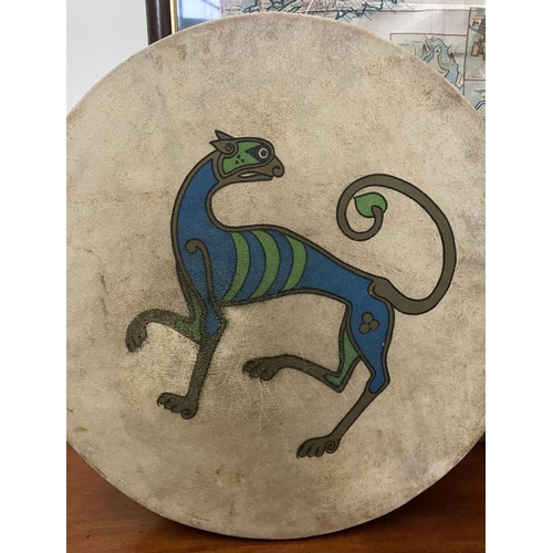 193 - TWO IRISH BODHRAN DRUMS, both with nice Celtic designs, dimensions: 45.5cm & 46.5cm diameter approx.