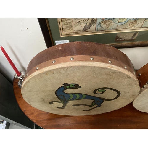 193 - TWO IRISH BODHRAN DRUMS, both with nice Celtic designs, dimensions: 45.5cm & 46.5cm diameter approx.