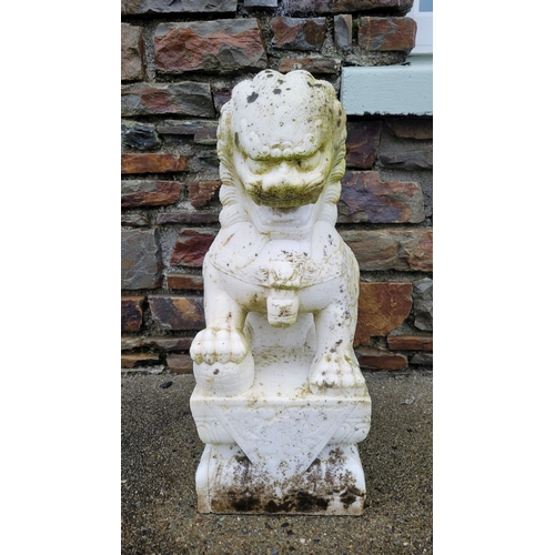 197 - A PAIR OF MARBLE GARDEN ORNAMENTS IN THE FORM OF GUARDIAN LIONS, one male, one female, one with a pa... 