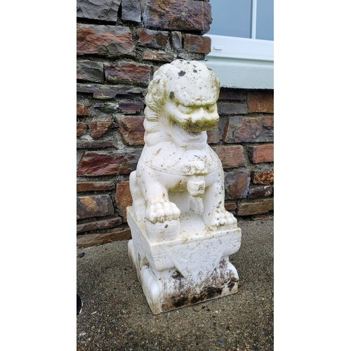 197 - A PAIR OF MARBLE GARDEN ORNAMENTS IN THE FORM OF GUARDIAN LIONS, one male, one female, one with a pa... 