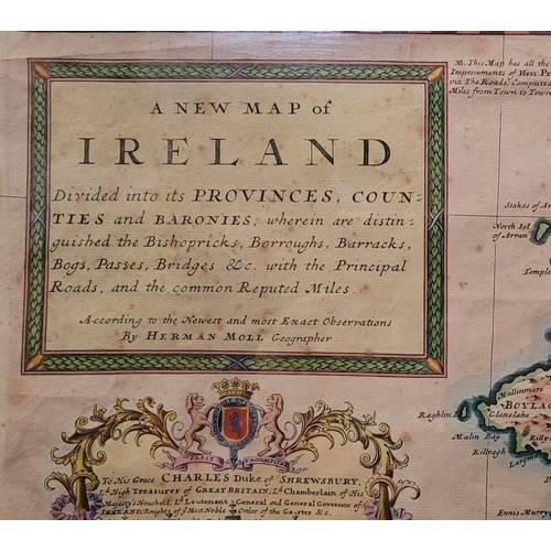 21 - A FRAMED RARE MAP OF IRELAND: 18TH CENTURY: hand coloured example of Herman Moll’s 1714 map of the i... 