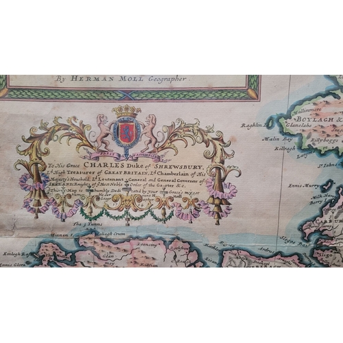 21 - A FRAMED RARE MAP OF IRELAND: 18TH CENTURY: hand coloured example of Herman Moll’s 1714 map of the i... 