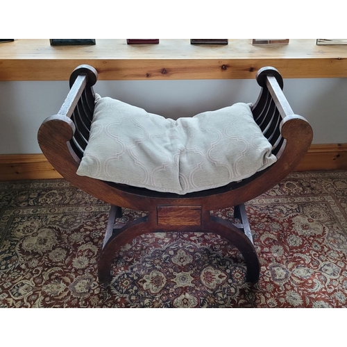 216 - A 19TH CENTURY OAK CURVED WINDOW / PIANO SEAT, with five bar curved elbow rests on each side, raised... 