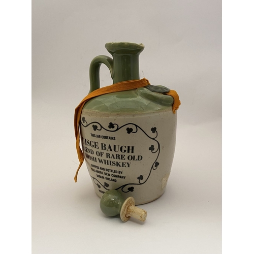 222 - A VINTAGE STONEWARE TULLAMORE DEW DECANTER, with wax seal to top embossed 1791, the front reading ‘T... 