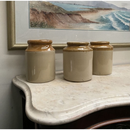 225 - THREE VINTAGE TWO-TONE GLAZED STONEWARE JARS, one by Skey Tamworth, all with two tone glazed design.... 