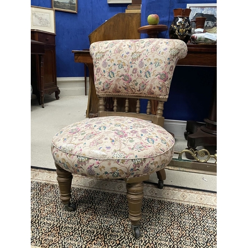 231 - A CHARMING WELSH LOW RISE NURSING CHAIR, with circular cushioned seat, curved headrest supported on ... 