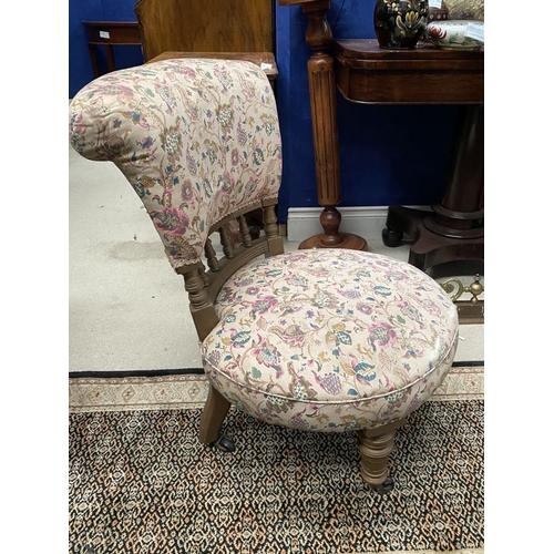 231 - A CHARMING WELSH LOW RISE NURSING CHAIR, with circular cushioned seat, curved headrest supported on ... 