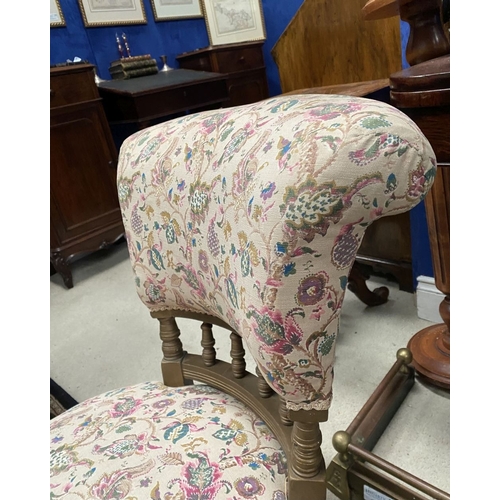 231 - A CHARMING WELSH LOW RISE NURSING CHAIR, with circular cushioned seat, curved headrest supported on ... 