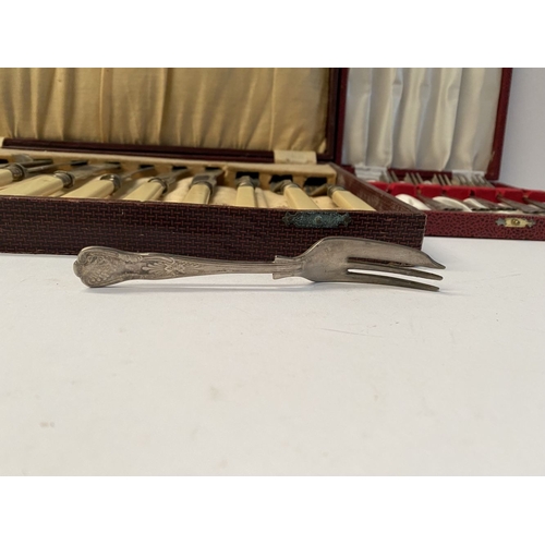 248 - TWO VINTAGE CASED SILVER PLATED CUTLERY SETS, (i) six fish knives and forks, all with nice engraved ... 