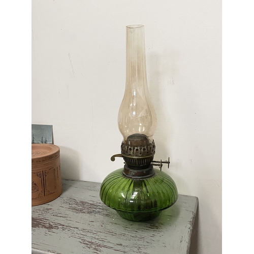 33 - A VICTORIAN GREEN GLASS DOUBLE BURNER OIL LAMP, complete with glass chimney, the double burners read... 