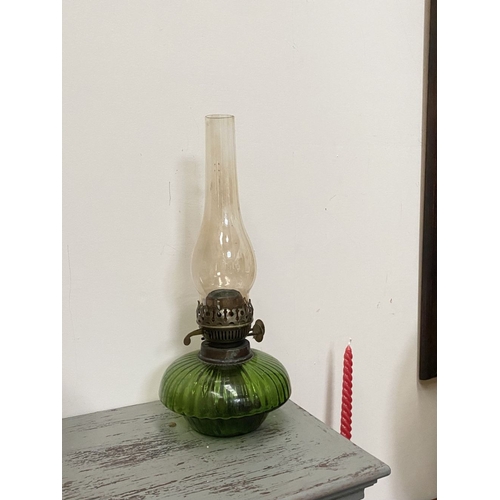 33 - A VICTORIAN GREEN GLASS DOUBLE BURNER OIL LAMP, complete with glass chimney, the double burners read... 