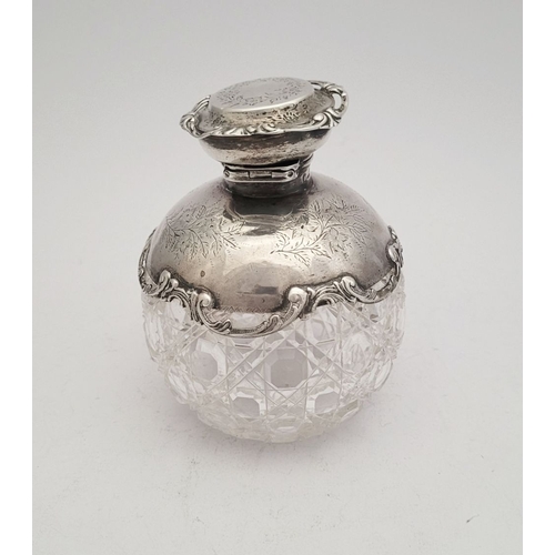 35 - A LOVELY EARLY 20TH CENTURY SILVER TOPPED CUT GLASS SCENT BOTTLE, the lid, and shoulders capped with... 