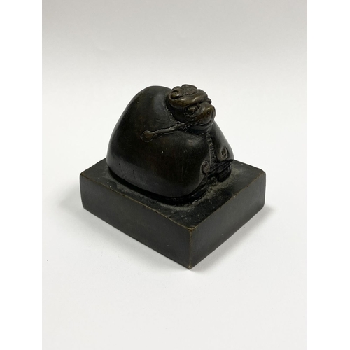 4 - A SUBSTANTIAL QING DYNASTY CHINESE BRONZE SEAL, the seal surmounted by Chinese mythical creature, po... 