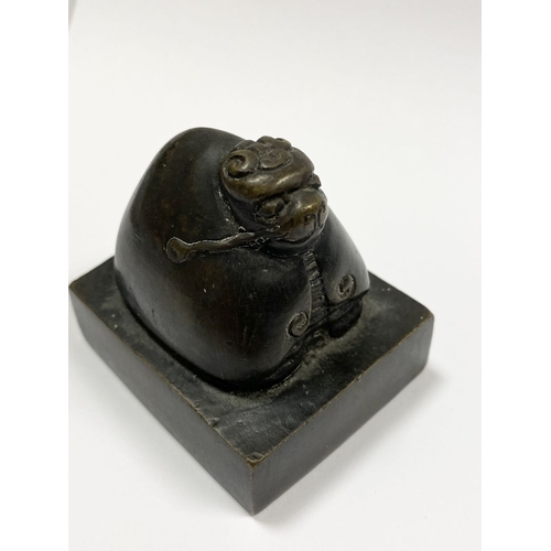 4 - A SUBSTANTIAL QING DYNASTY CHINESE BRONZE SEAL, the seal surmounted by Chinese mythical creature, po... 