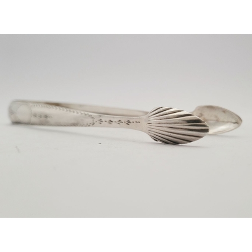 62 - A GEORGE III BRIGHT CUT DECORATED IRISH SILVER SUGAR TONGS, circa 1795, with maker’s mark of J. Powe... 