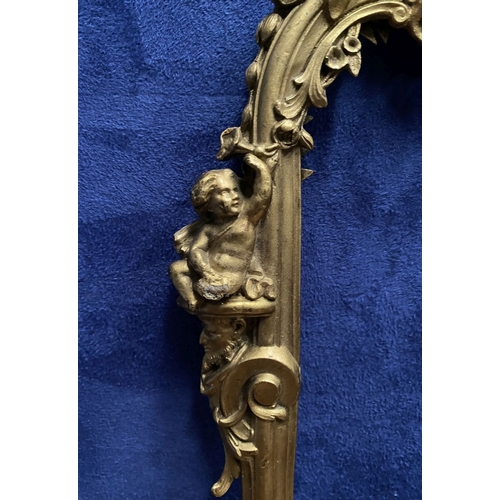 64 - A 19TH CENTURY ORNATE GILT BRONZE FRAME, neo classical with cherub mounts to sides, scrolling crest ... 