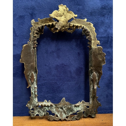 64 - A 19TH CENTURY ORNATE GILT BRONZE FRAME, neo classical with cherub mounts to sides, scrolling crest ... 