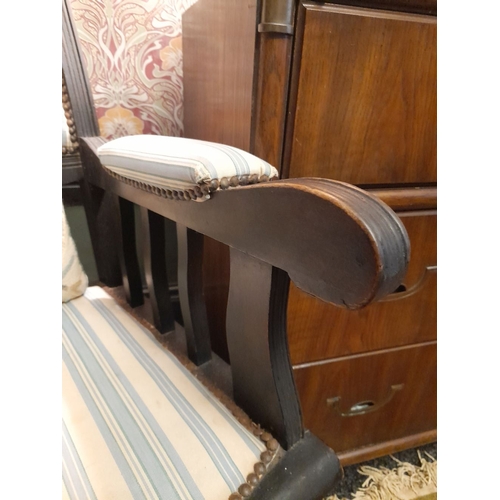 77 - AN EDWARDIAN ROCKING CHAIR, stud upholstered to headrest, backrest, armrests and seat. The supports ... 