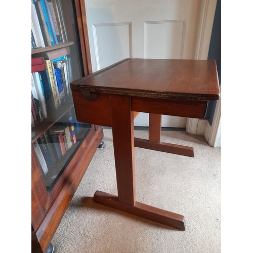 95 - A VINTAGE SIDE TABLE/CHILDREN’S DESK, top lifts to reveal storage, raised on two side supports. Dime... 