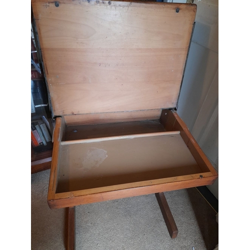 95 - A VINTAGE SIDE TABLE/CHILDREN’S DESK, top lifts to reveal storage, raised on two side supports. Dime... 