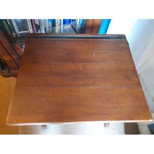 95 - A VINTAGE SIDE TABLE/CHILDREN’S DESK, top lifts to reveal storage, raised on two side supports. Dime... 