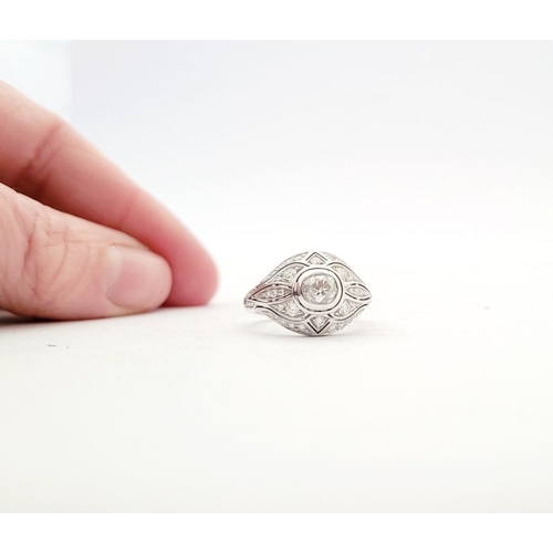 10 - A STUNNING 18CT WHITE GOLD DIAMOND BOMBÉ COCKTAIL RING, with a central round cut diamond surrounded ... 