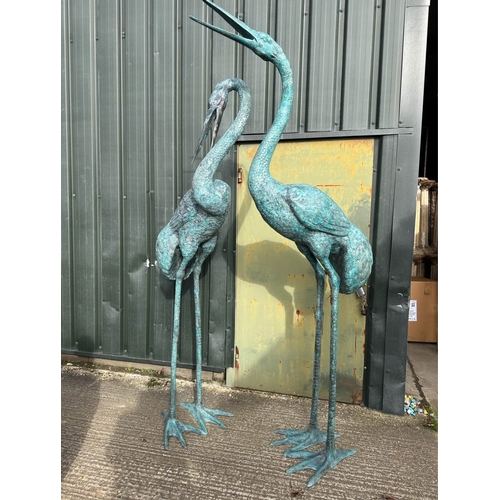 181 - A PAIR OF LARGE BRONZE HERON GARDEN ORNAMENTS, dimensions: 8ft & 10ft high approx.