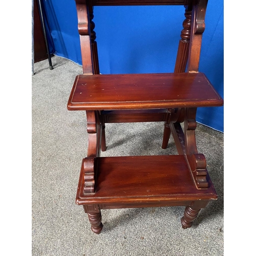 128 - AN UNUSUAL MAHOGANY THREE STEP LIBRARY LADDER, raised on turned & reed decorated legs to the back, w... 