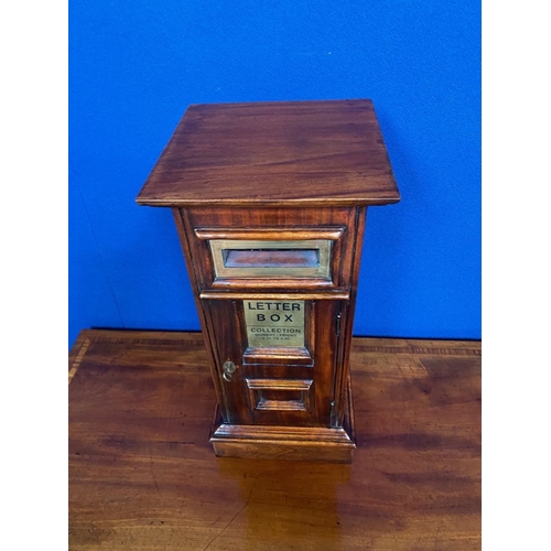 180 - A DECORATIVE LETTER BOX: A good quality mahogany letter box with brass metal detailing. Letter openi... 