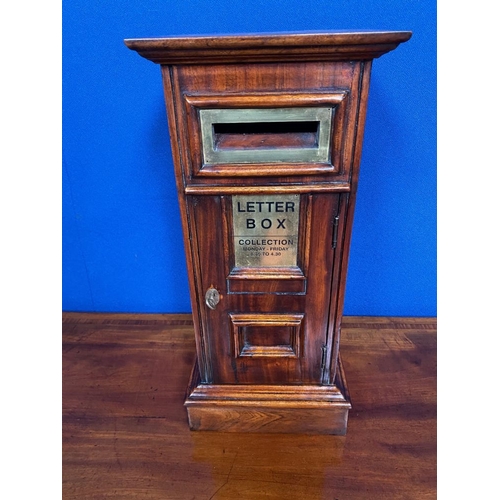 180 - A DECORATIVE LETTER BOX: A good quality mahogany letter box with brass metal detailing. Letter openi... 