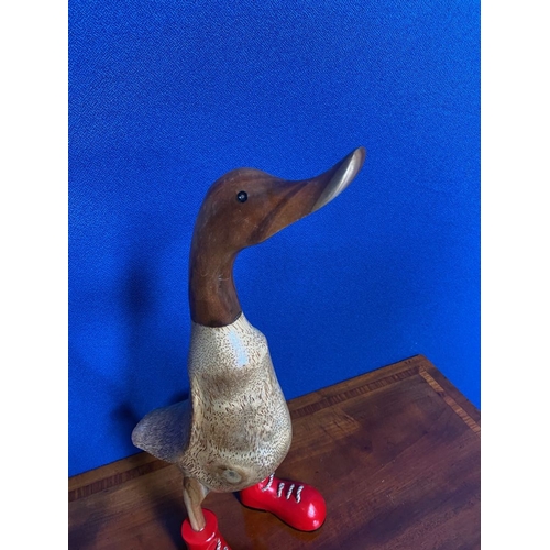 201 - TWO PAINTED WOODEN ORNAMENTS IN THE FORM OF DUCKS, both wearing red boots. Quirky decorative pair. E... 