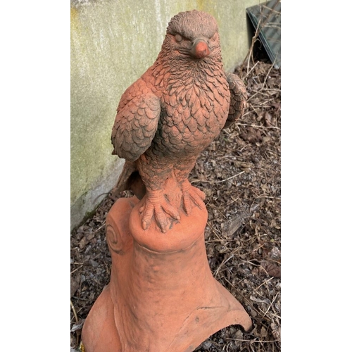 278 - A GARDEN ORNAMENT IN THE FORM OF A HAWK, standing upon a platform base with curved support. 59cm tal... 