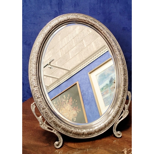 11 - A LOVELY EARLY 20TH CENTURY STERLING SILVER FRAMED TABLE TOP MIRROR, the oval shaped mirror with bev... 