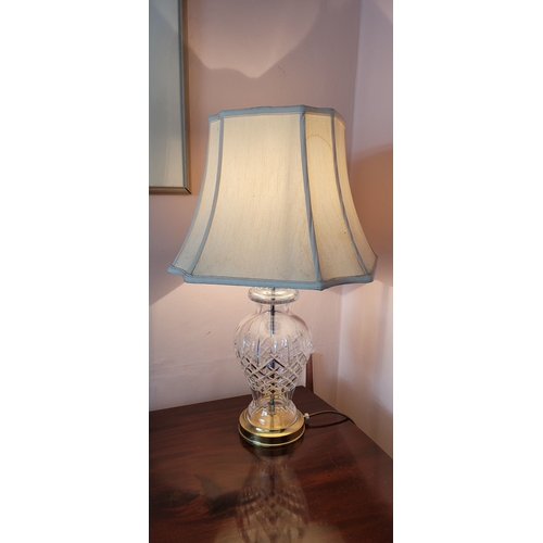 112 - A CONTEMPORARY CUT GLASS TABLE LAMP, with shade. Currently in working order. 67cm tall including sha... 