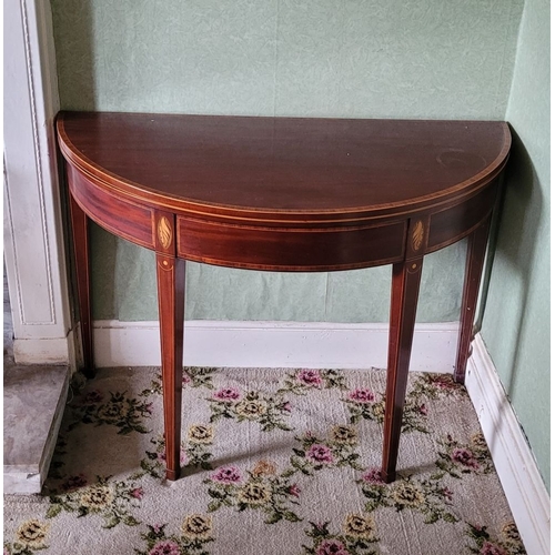 119 - A VERY FINE MAHOGANY INLAID FOLD OVER CARD TABLE, finely inlaid detail to the curved front with shel... 