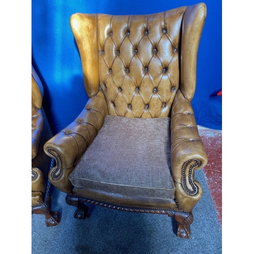 125 - AN EXCELLENT QUALITY PAIR OF TAN LEATHER CHESTERFIELD WINGBACK ARMCHAIRS, each with nice deep button... 