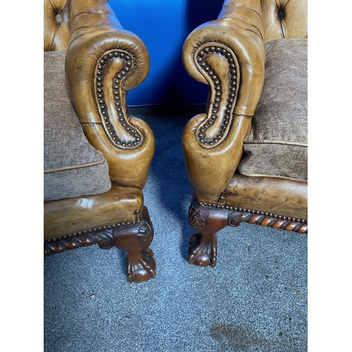 125 - AN EXCELLENT QUALITY PAIR OF TAN LEATHER CHESTERFIELD WINGBACK ARMCHAIRS, each with nice deep button... 