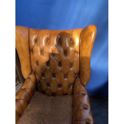 125 - AN EXCELLENT QUALITY PAIR OF TAN LEATHER CHESTERFIELD WINGBACK ARMCHAIRS, each with nice deep button... 