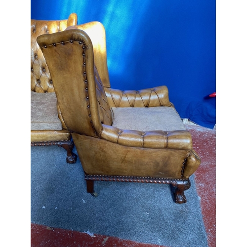 125 - AN EXCELLENT QUALITY PAIR OF TAN LEATHER CHESTERFIELD WINGBACK ARMCHAIRS, each with nice deep button... 