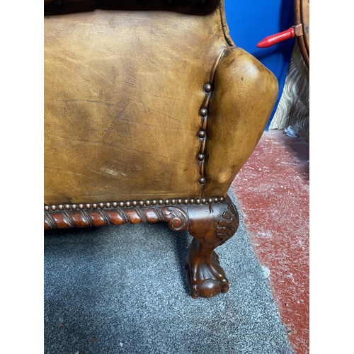 125 - AN EXCELLENT QUALITY PAIR OF TAN LEATHER CHESTERFIELD WINGBACK ARMCHAIRS, each with nice deep button... 