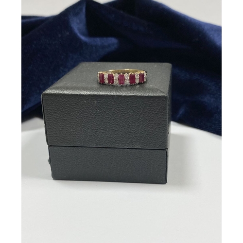 130 - A 14CT YELLOW GOLD RUBY & DIAMOND BAND RING, with five vibrant emerald cut rubies, weighing: 2.04cts... 