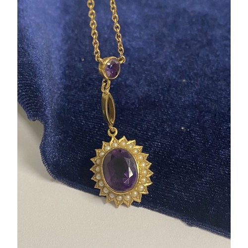 132 - A BEAUTIFUL 9CT GOLD AMETHYST AND SEED PEARL PENDANT NECKLACE, with central large oval cut vibrant a... 