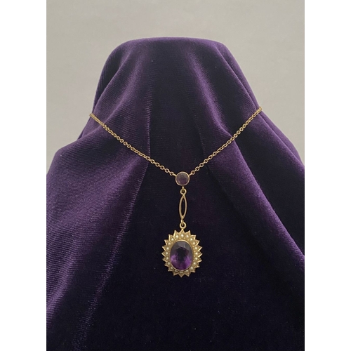 132 - A BEAUTIFUL 9CT GOLD AMETHYST AND SEED PEARL PENDANT NECKLACE, with central large oval cut vibrant a... 